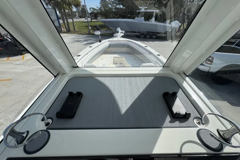 Slide: The Image of Interior view of 2026 Blackwood 270 LXF boat, showcasing helm and deck area. - 34