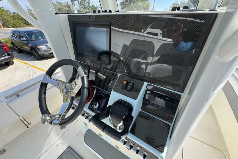 Slide: The Image of 2026 Blackwood 270 LXF boat dashboard with steering wheel and electronic controls. - 35