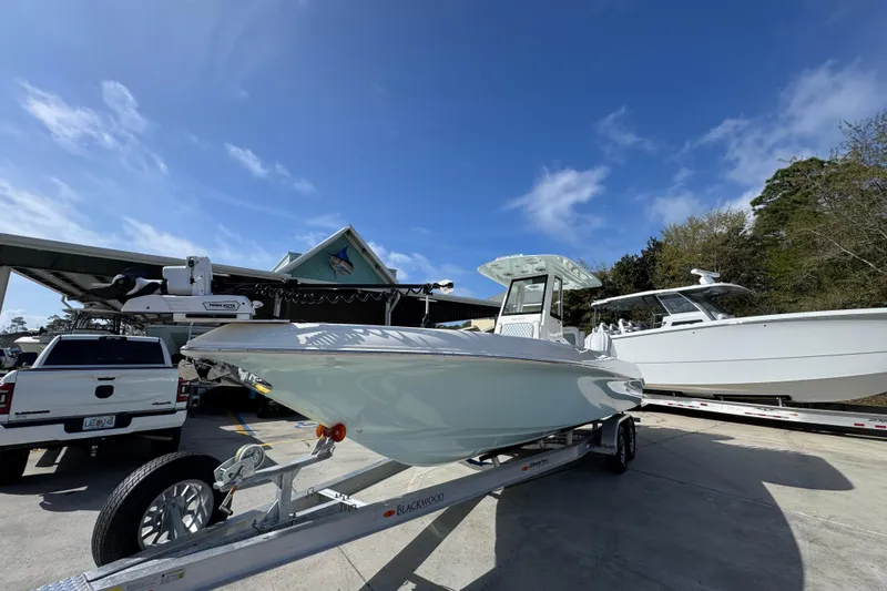 Slide: The Image of 2026 Blackwood 270 LXF boat on trailer under clear blue sky. - 4