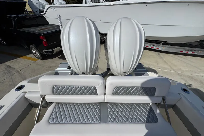 Slide: The Image of 2026 Blackwood 270 LXF boat with dual engines and quilted seating, parked on a trailer. - 40