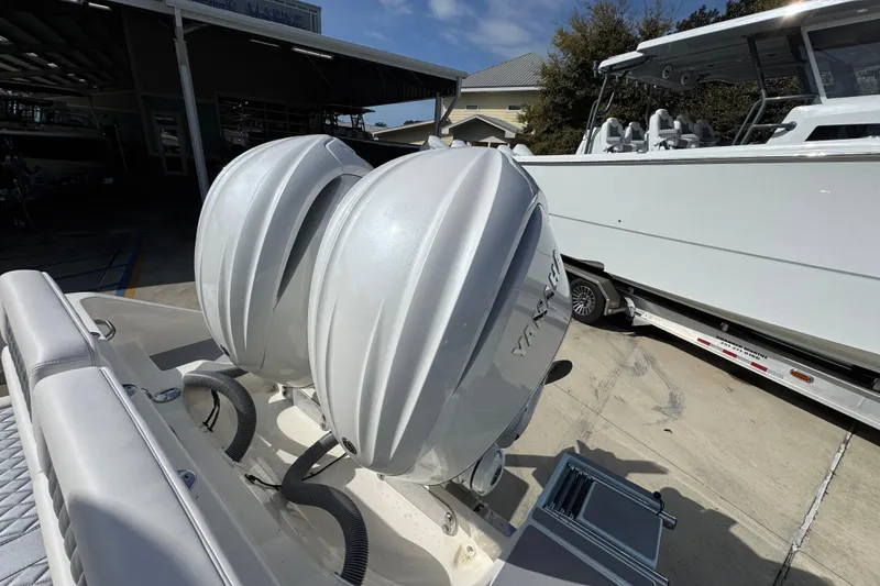 Slide: The Image of 2026 Blackwood 270 LXF boat with dual outboard engines in a marina setting. - 41