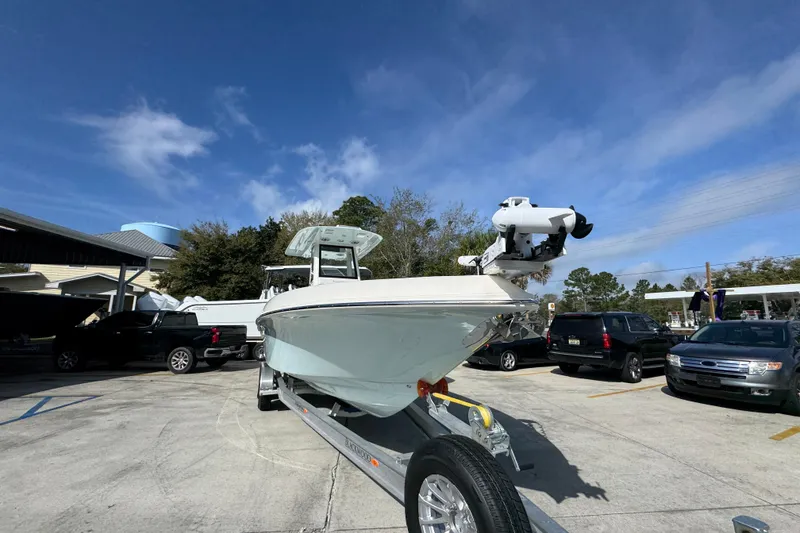 Slide: The Image of 2026 Blackwood 270 LXF boat on trailer in parking lot under blue sky. - 7
