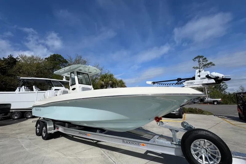 Slide: The Image of 2026 Blackwood 270 LXF boat on trailer under clear blue sky. - 8