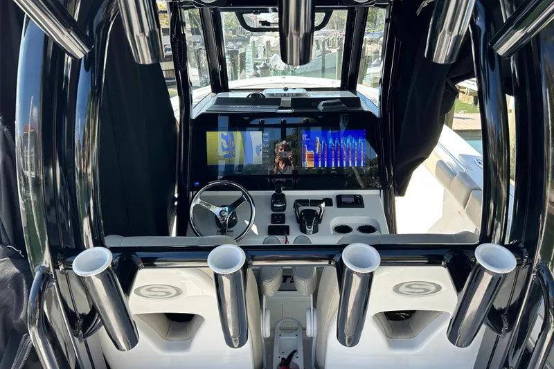 Slide: The Image of 2021 Sportsman Open 302 Center Console boat interior with advanced navigation display. - 15