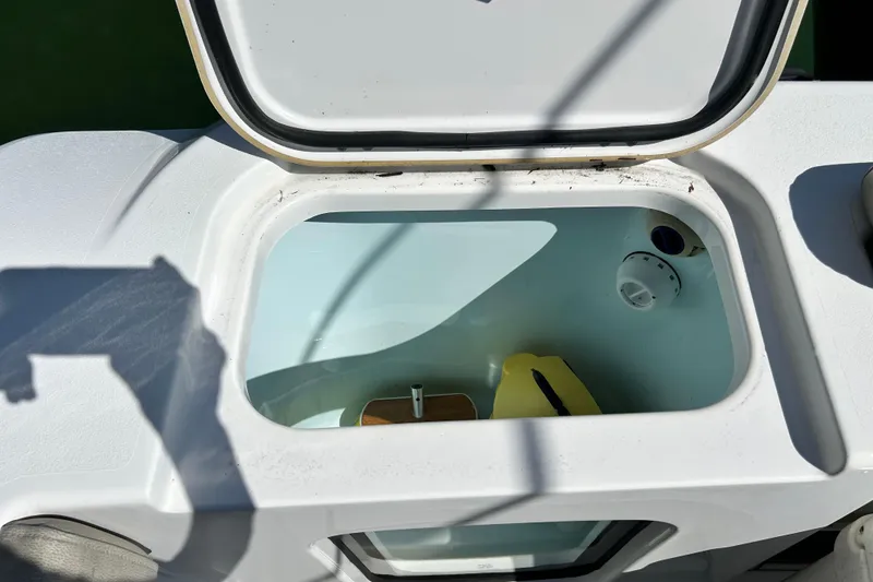 Slide: The Image of Open storage compartment on 2021 Sportsman Open 302 Center Console boat. - 20