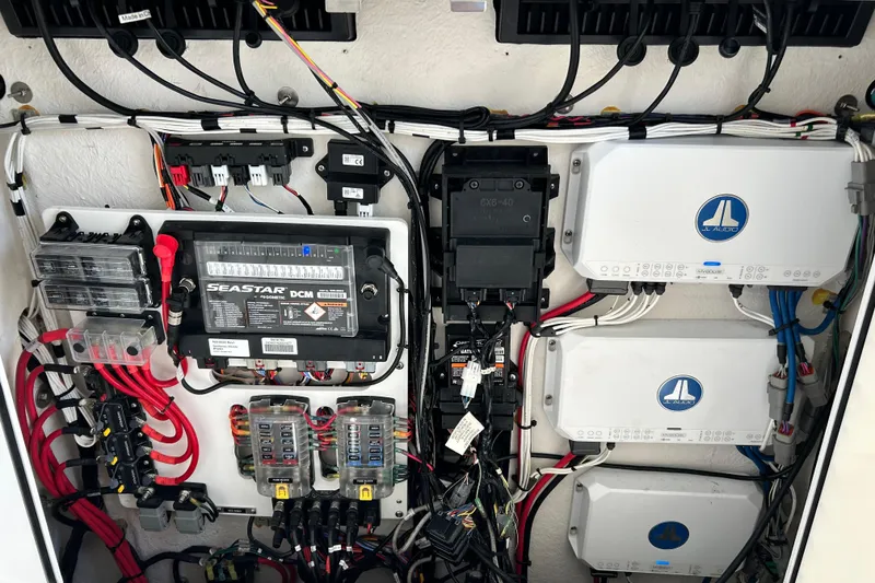Slide: The Image of Electrical system of a 2021 Sportsman Open 302 Center Console boat with JL Audio components. - 26
