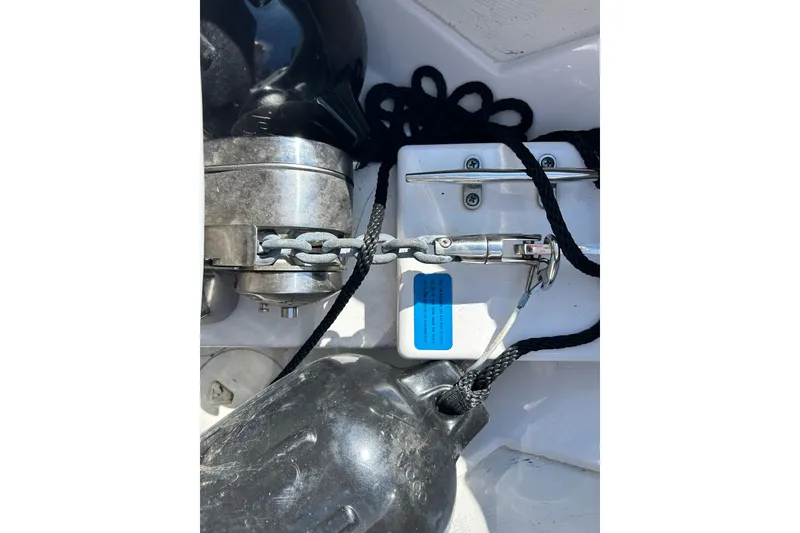 Slide: The Image of Anchor chain and cleat on 2021 Sportsman Open 302 Center Console boat. - 5