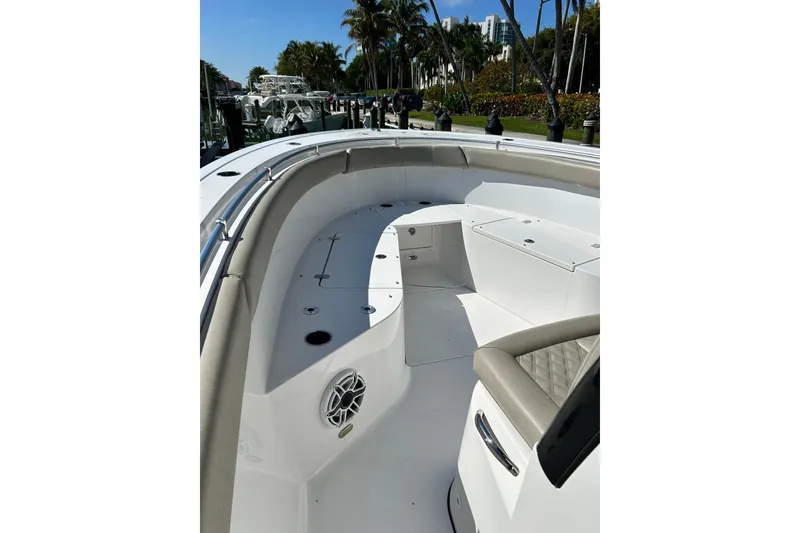 Slide: The Image of 2021 Sportsman Open 302 Center Console boat interior with seating and speaker. - 6