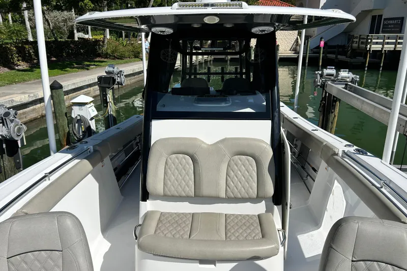 Slide: The Image of 2021 Sportsman Open 302 Center Console boat interior with cushioned seating. - 7