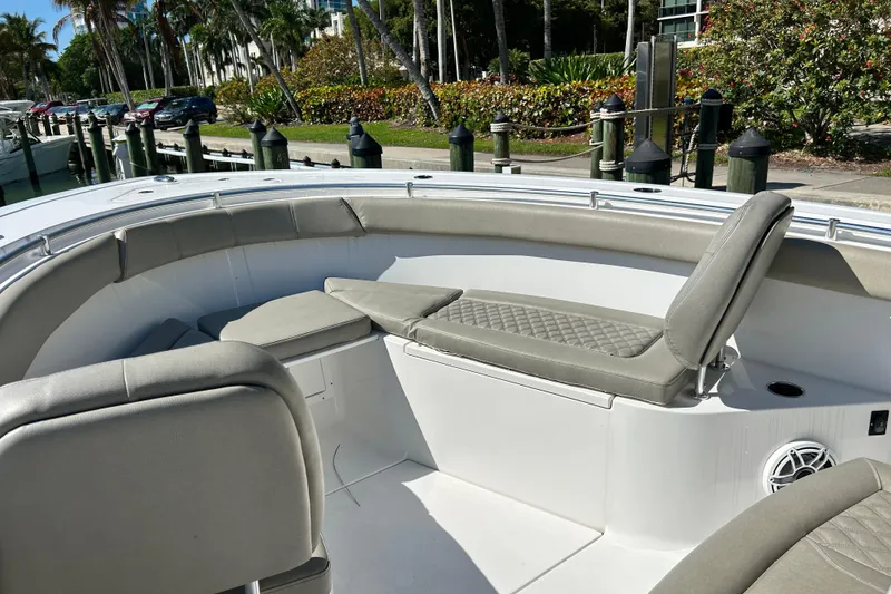 Slide: The Image of 2021 Sportsman Open 302 Center Console boat interior with cushioned seating. - 9