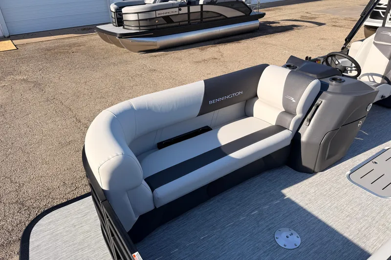 Slide: The Image of 2026 Bennington 22 S-One Quad Bench pontoon boat with stylish seating and modern design. - 11