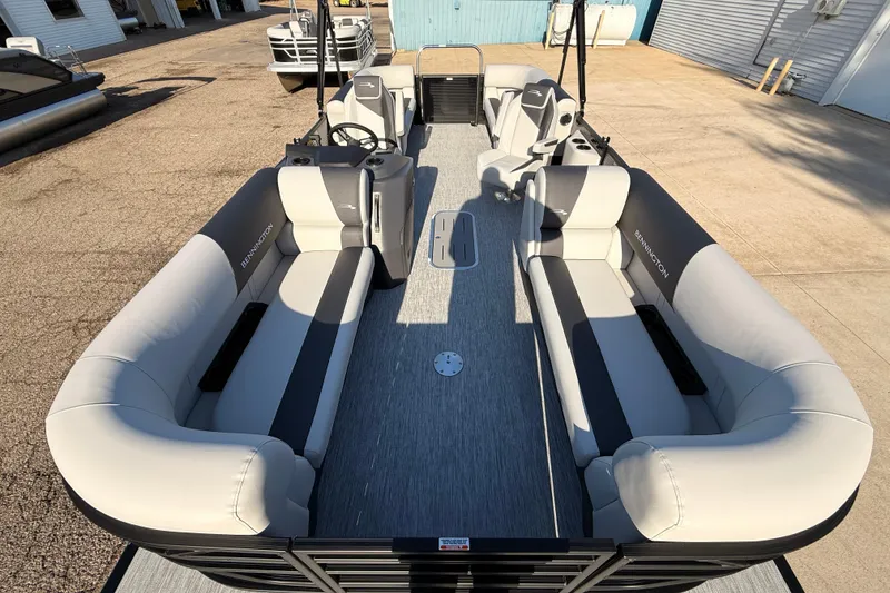 Slide: The Image of 2026 Bennington 22 S-One Quad Bench pontoon boat with spacious seating and modern design. - 13