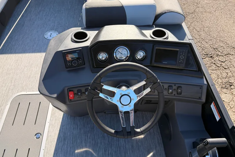 Slide: The Image of Steering console of 2026 Bennington 22 S-One Quad Bench boat with modern controls. - 17