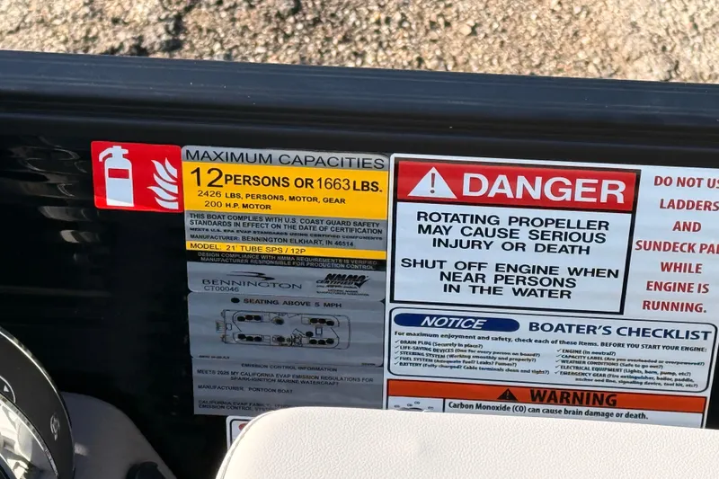 Slide: The Image of Safety and capacity labels on a 2026 Bennington 22 S-One Quad Bench boat. - 18