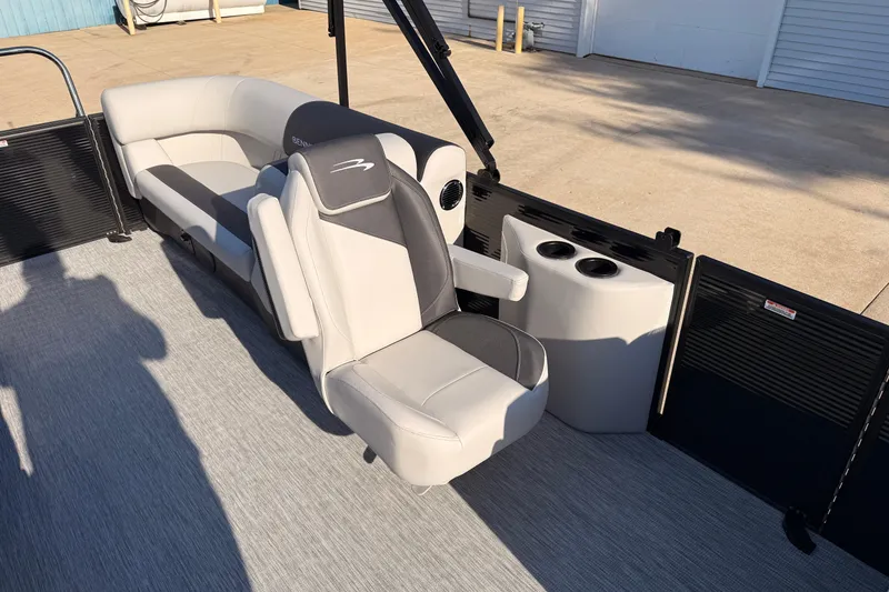 Slide: The Image of 2026 Bennington 22 S-One Quad Bench interior with plush seating and cup holders. - 20
