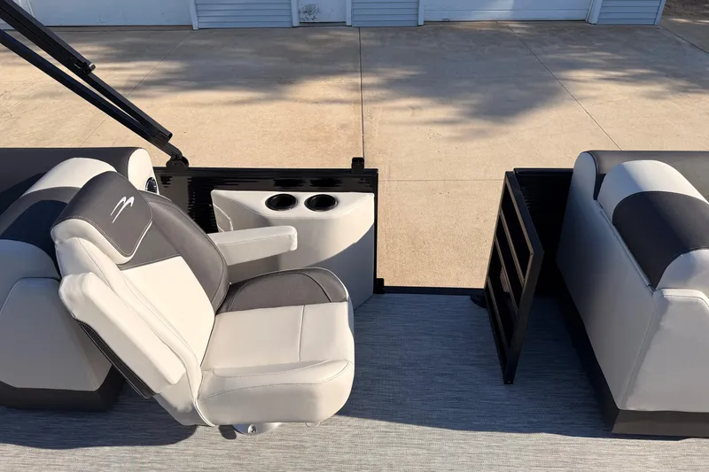 Slide: The Image of 2026 Bennington 22 S-One Quad Bench interior with comfortable seating and cup holders. - 21