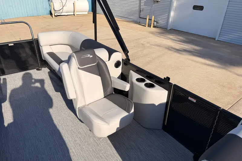 Slide: The Image of 2026 Bennington 22 S-One Quad Bench interior with gray seating and cup holders. - 22