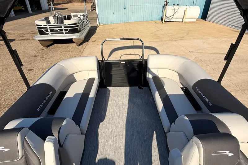 Slide: The Image of 2026 Bennington 22 S-One Quad Bench pontoon boat interior with plush seating. - 26