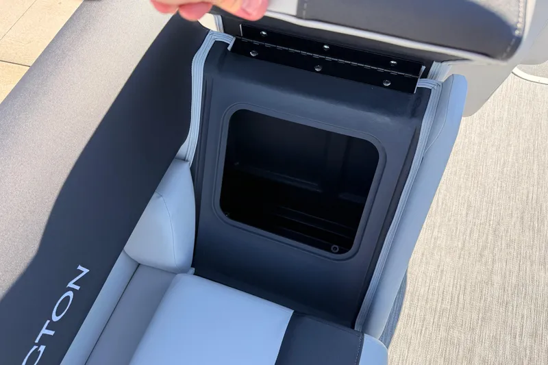Slide: The Image of Open storage compartment in 2026 Bennington 22 S-One Quad Bench boat seat. - 31