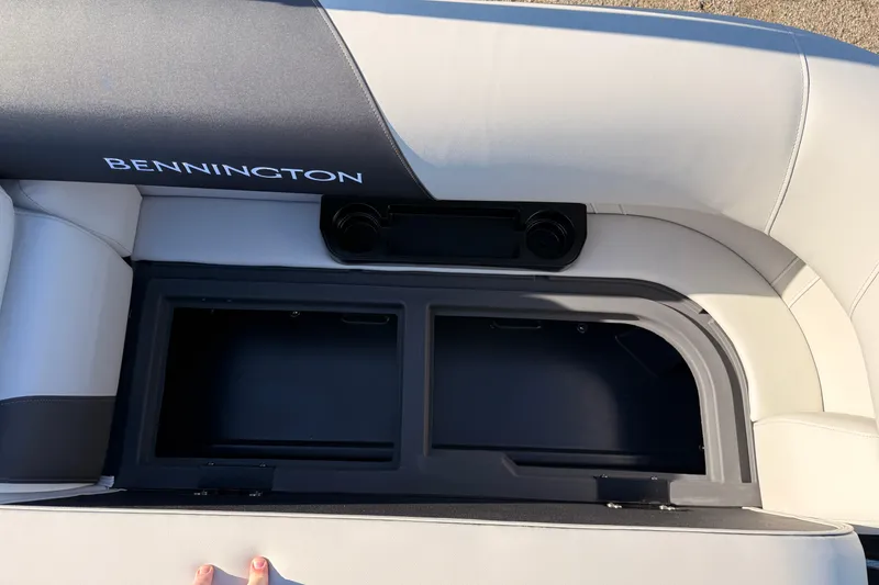 Slide: The Image of 2026 Bennington 22 S-One Quad Bench with open storage compartment, showcasing sleek design. - 32