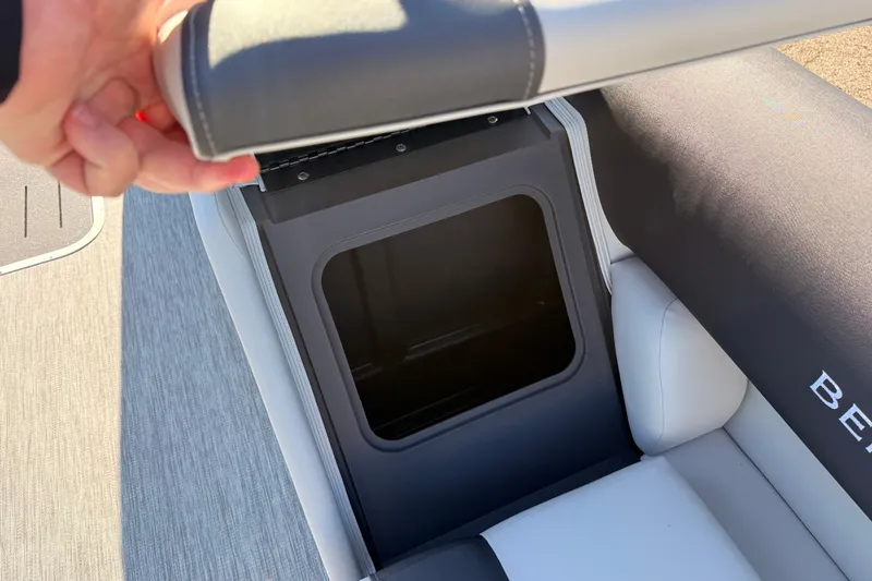 Slide: The Image of Bennington 22 S-One Quad Bench storage compartment, 2026 model, with open seat view. - 33