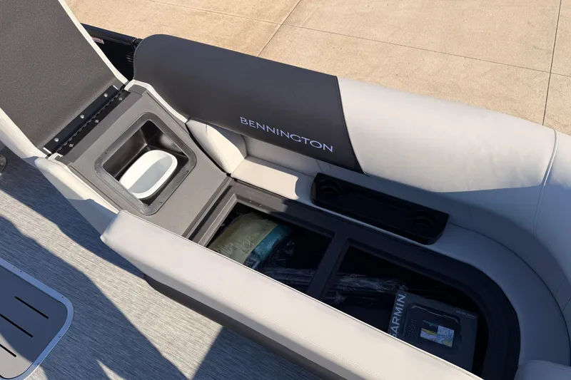 Slide: The Image of 2026 Bennington 22 S-One Quad Bench with open storage compartment and sleek seating design. - 37