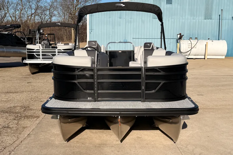Slide: The Image of 2026 Bennington 22 S-One Quad Bench pontoon boat on display outdoors. - 5