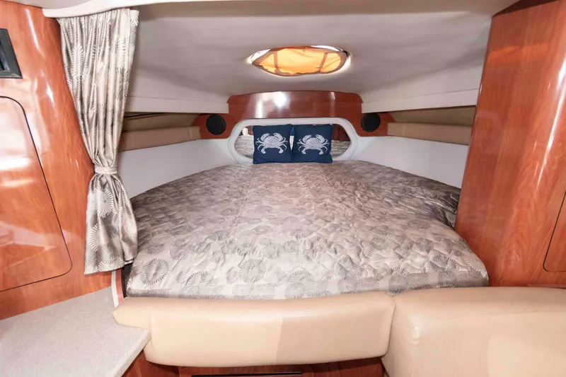 Slide: The Image of Luxurious cabin interior of 2015 Crownline 350 SY yacht with cozy bedding. - 14