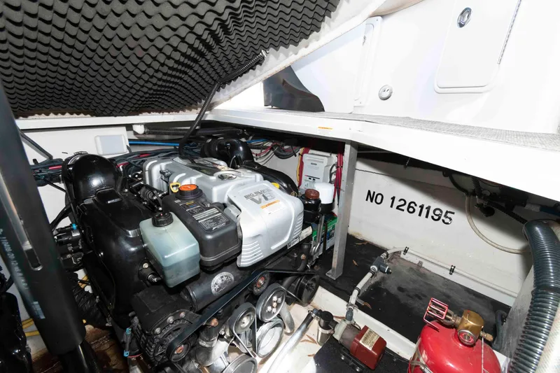 Slide: The Image of Engine compartment of a 2015 Crownline 350 SY boat, showcasing detailed machinery. - 18