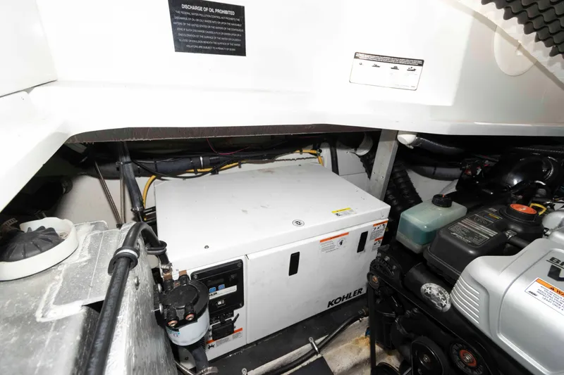 Slide: The Image of Engine compartment of 2015 Crownline 350 SY boat with Kohler generator. - 20