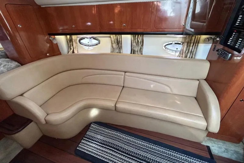 Slide: The Image of Luxurious interior of 2015 Crownline 350 SY yacht with beige leather seating. - 9