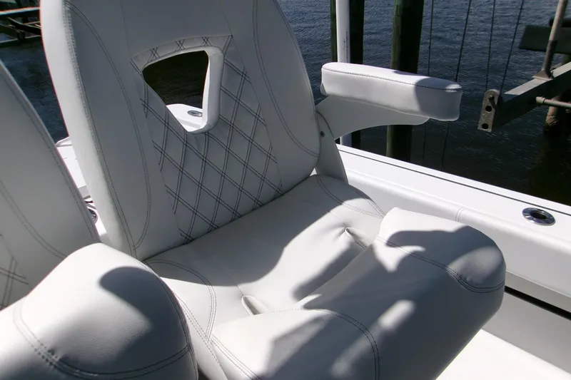 Slide: The Image of 2024 Sportsman Masters 267OE Bay Boat seat with elegant stitching and armrest. - 14