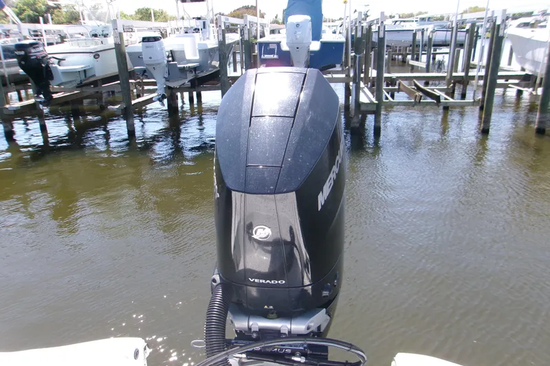 Slide: The Image of 2024 Sportsman Masters 267OE Bay Boat with Mercury Verado engine at dock. - 4