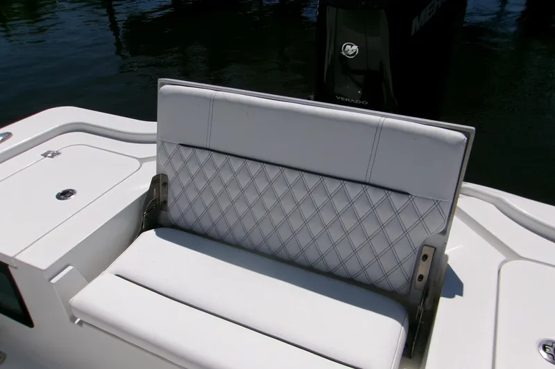 Slide: The Image of 2024 Sportsman Masters 267OE Bay Boat with cushioned seating and Verado engine. - 5