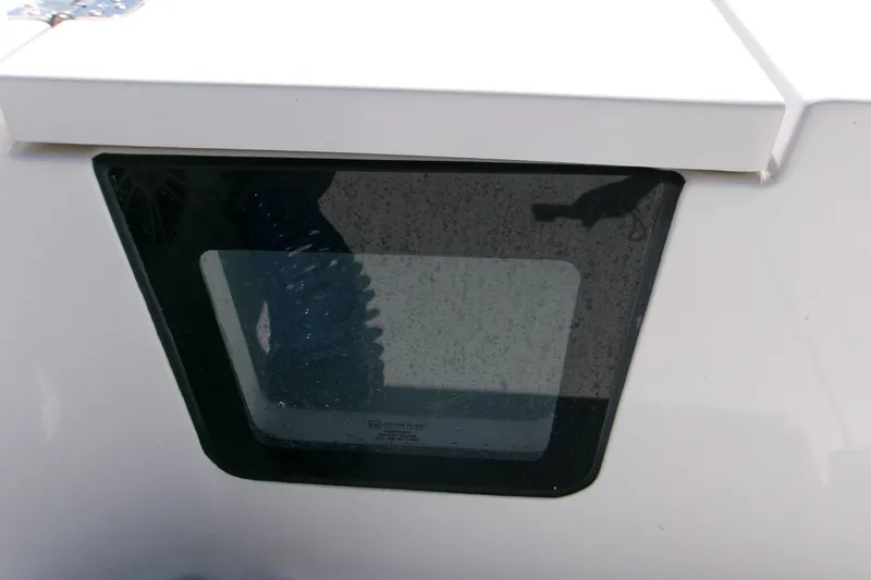 Slide: The Image of 2024 Sportsman Masters 267OE Bay Boat window detail with sleek design. - 6