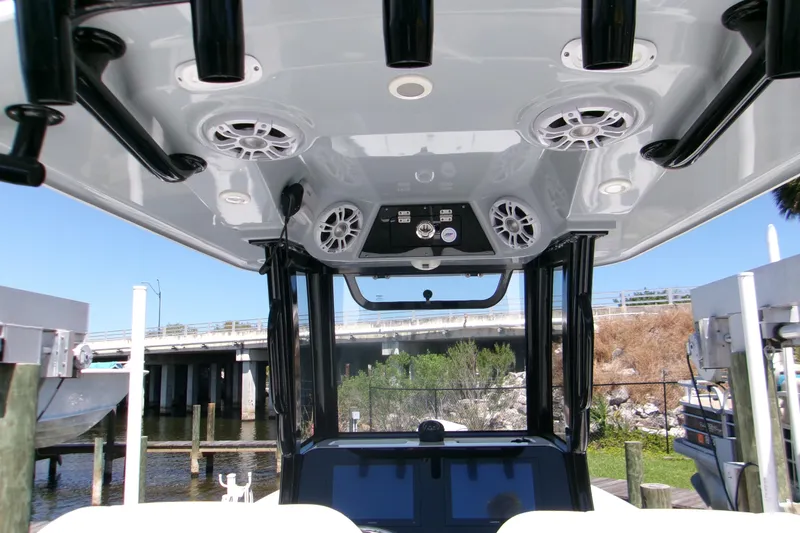 Slide: The Image of 2024 Sportsman Masters 267OE Bay Boat T-top with speakers and rod holders. - 8
