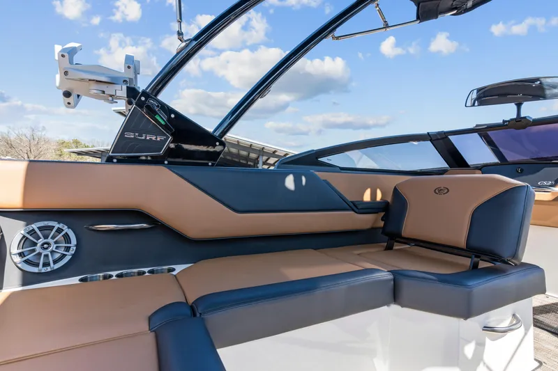 Slide: The Image of 2024 Cobalt CS23 Surf boat interior with luxurious seating and modern design. - 21