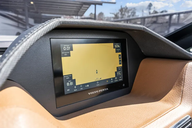 Slide: The Image of 2024 Cobalt CS23 Surf dashboard with Volvo Penta display, showing navigation and performance data. - 9