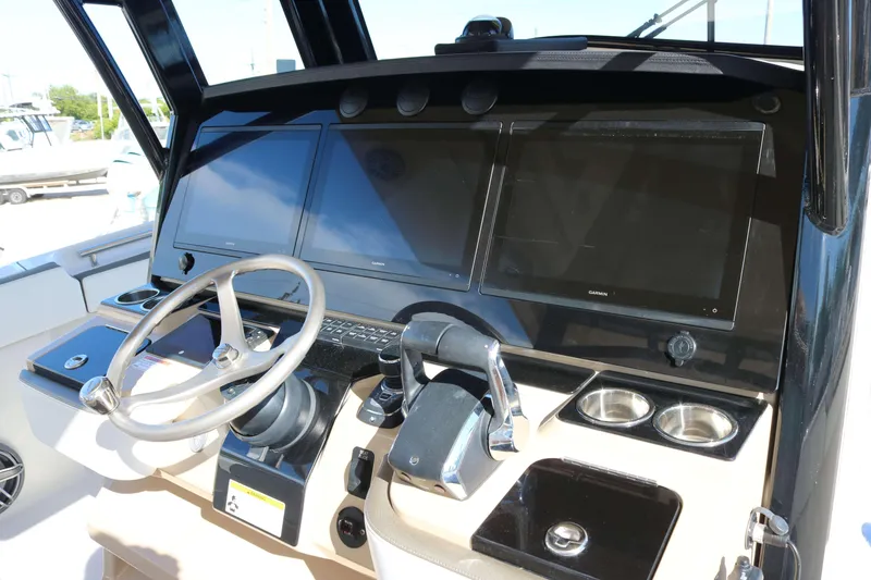 Slide: The Image of 2023 World Cat 400 CC-X helm with modern controls and dual displays. - 6