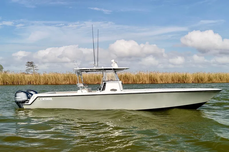 Slide: The Image of 2017 Contender 39 ST boat on calm water with clear sky background. - 5