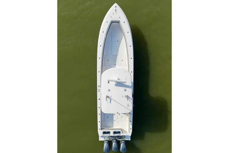 Slide: The Image of Top view of a 2017 Contender 39 ST boat on green water. - 6