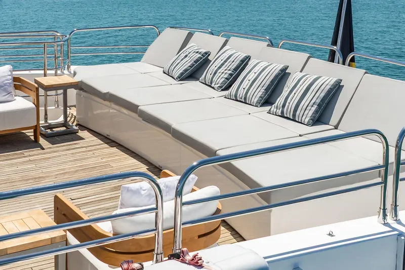 Slide: The Image of Luxurious Sunseeker 34 Metre Yacht 2010 deck with plush seating and striped cushions. - 25