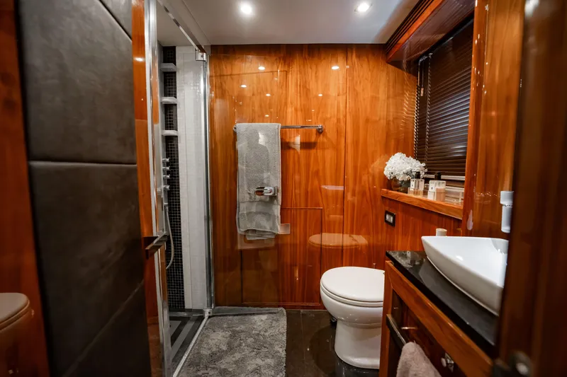 Slide: The Image of Luxurious bathroom on a 2010 Sunseeker 34 Metre Yacht with wood paneling and modern fixtures. - 26