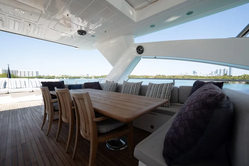 Slide: The Image of Luxurious Sunseeker 34 Metre Yacht 2010 deck with elegant seating and scenic waterfront view. - 27