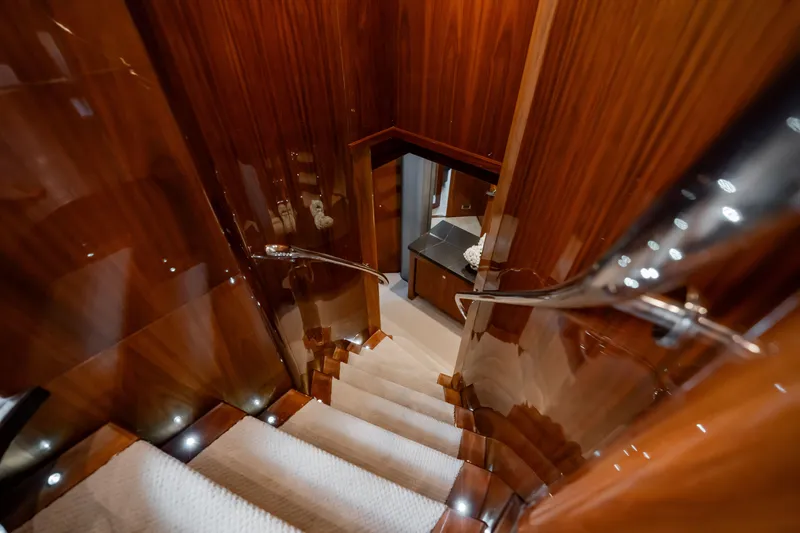 Slide: The Image of Luxurious wooden staircase inside 2010 Sunseeker 34 Metre Yacht, featuring elegant design. - 28