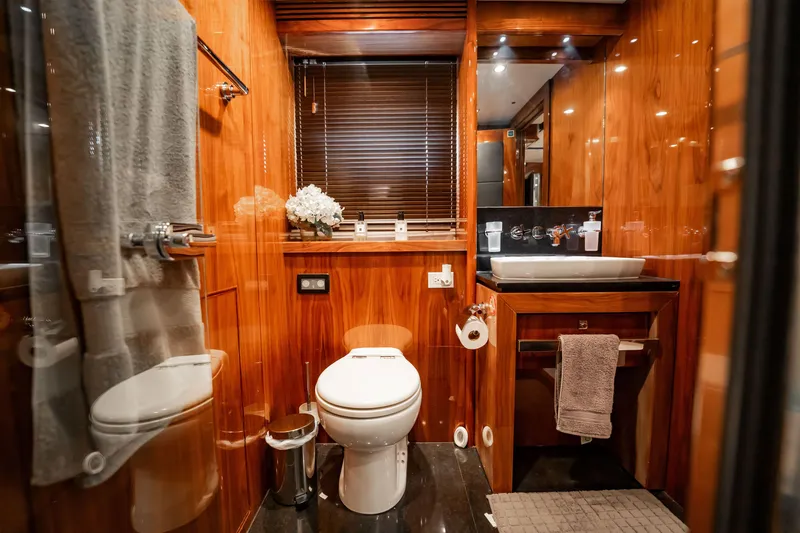 Slide: The Image of Luxurious bathroom on a 2010 Sunseeker 34 Metre Yacht with elegant wood finishes. - 29