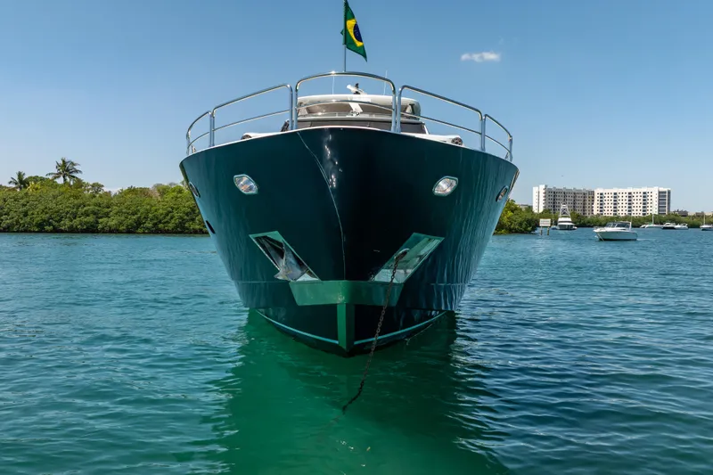 Slide: The Image of Front view of a 2010 Sunseeker 34 Metre Yacht on clear blue water. - 3
