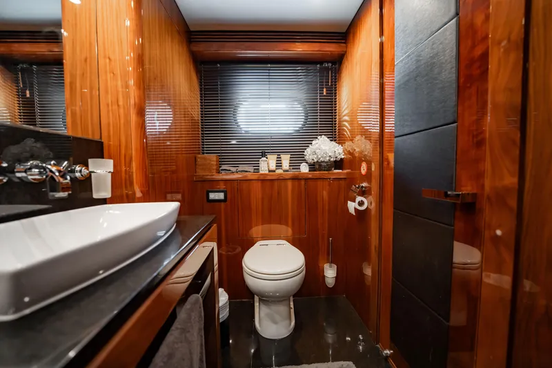 Slide: The Image of Luxurious bathroom on a 2010 Sunseeker 34 Metre Yacht with elegant wood finishes. - 33