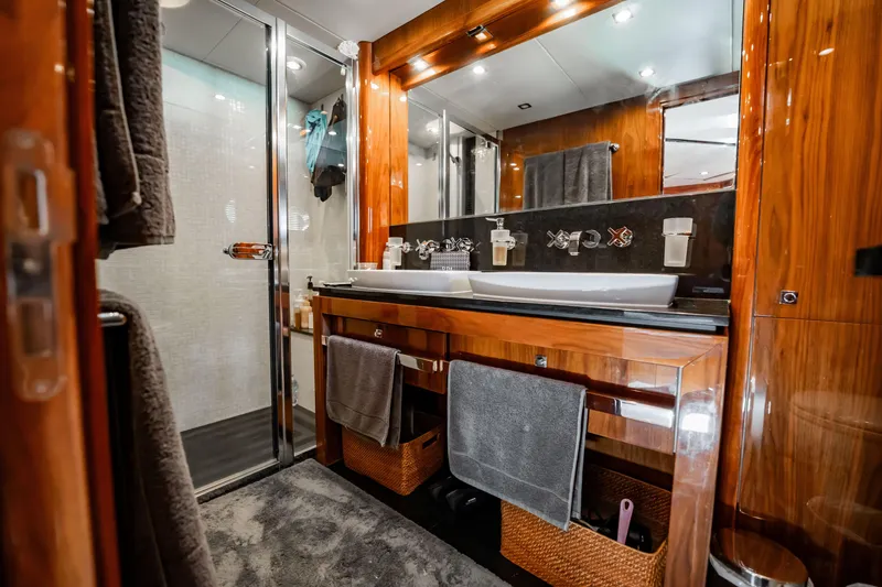 Slide: The Image of Luxurious bathroom on a 2010 Sunseeker 34 Metre Yacht with elegant wood finishes. - 34