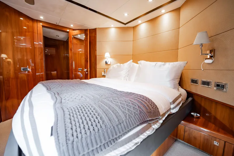 Slide: The Image of Luxurious bedroom interior on 2010 Sunseeker 34 Metre Yacht with elegant wood paneling. - 35